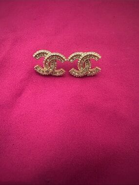 CHANEL Gold-Tone Double CC Crystal Stud Earrings on Pink- one loose stone